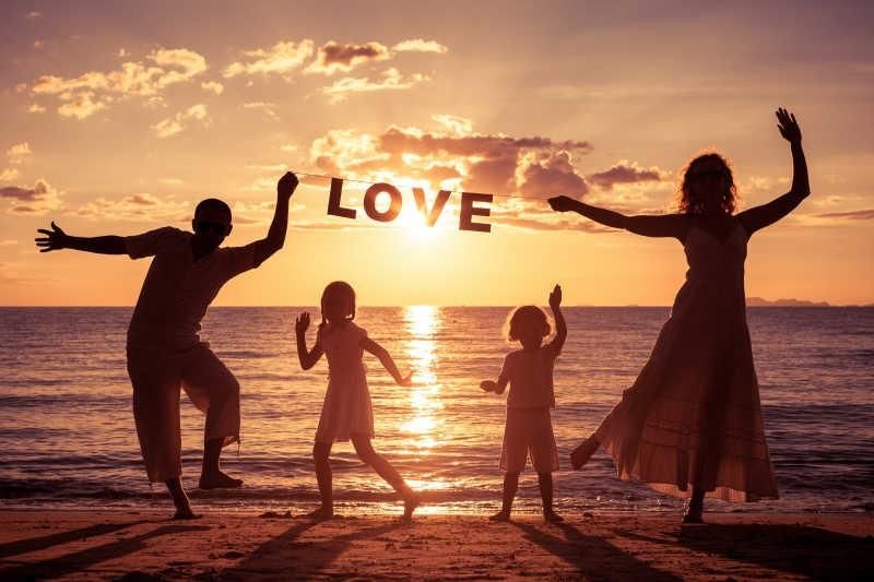 A happy family spending quality time together, parents and child laughing